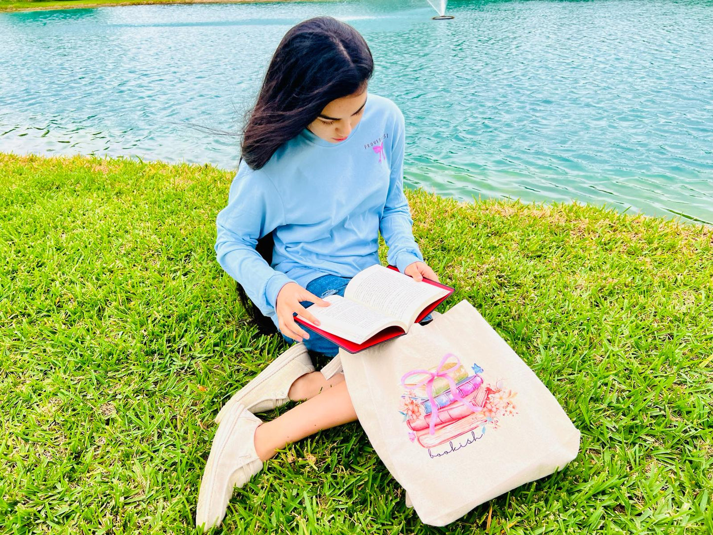 "Bookish" is our 100% Cotton twill Tote Bag in a natural color and a graphic of stacked books