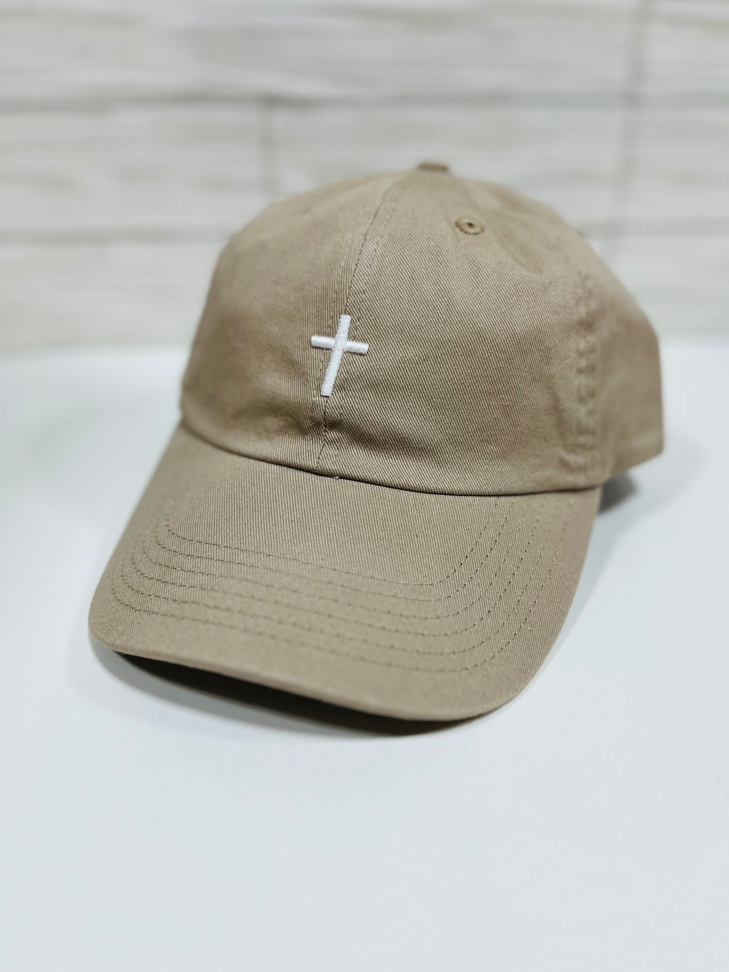 Unstructured "Cross Hat" embroidered with 3D Puff Tan color