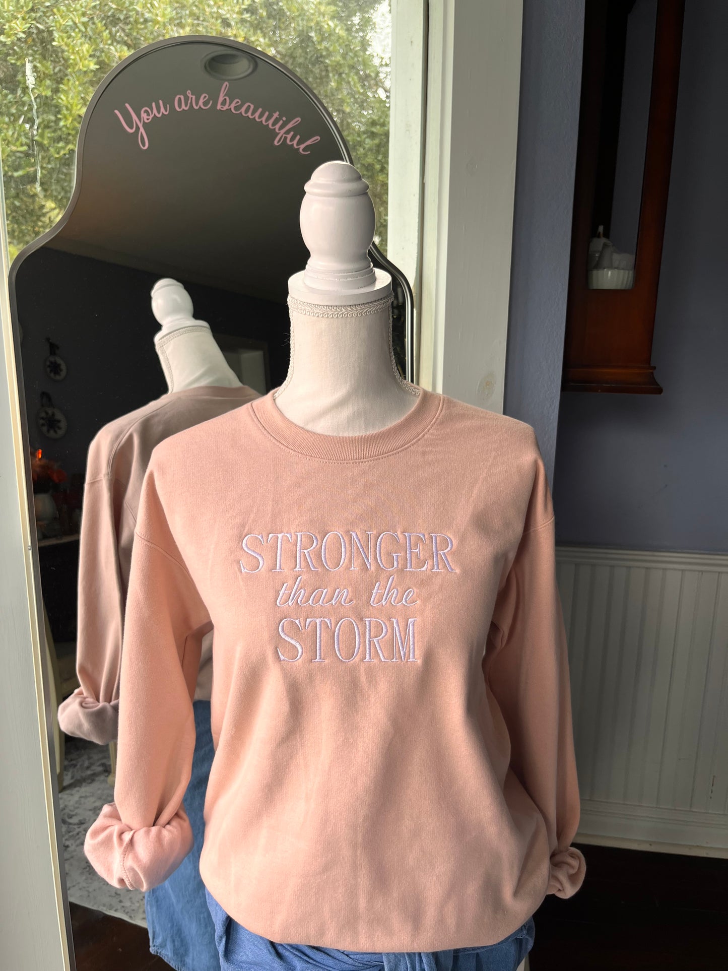 "Stronger Than The Storm" Blush Pink colored Crew Neck Sweatshirt