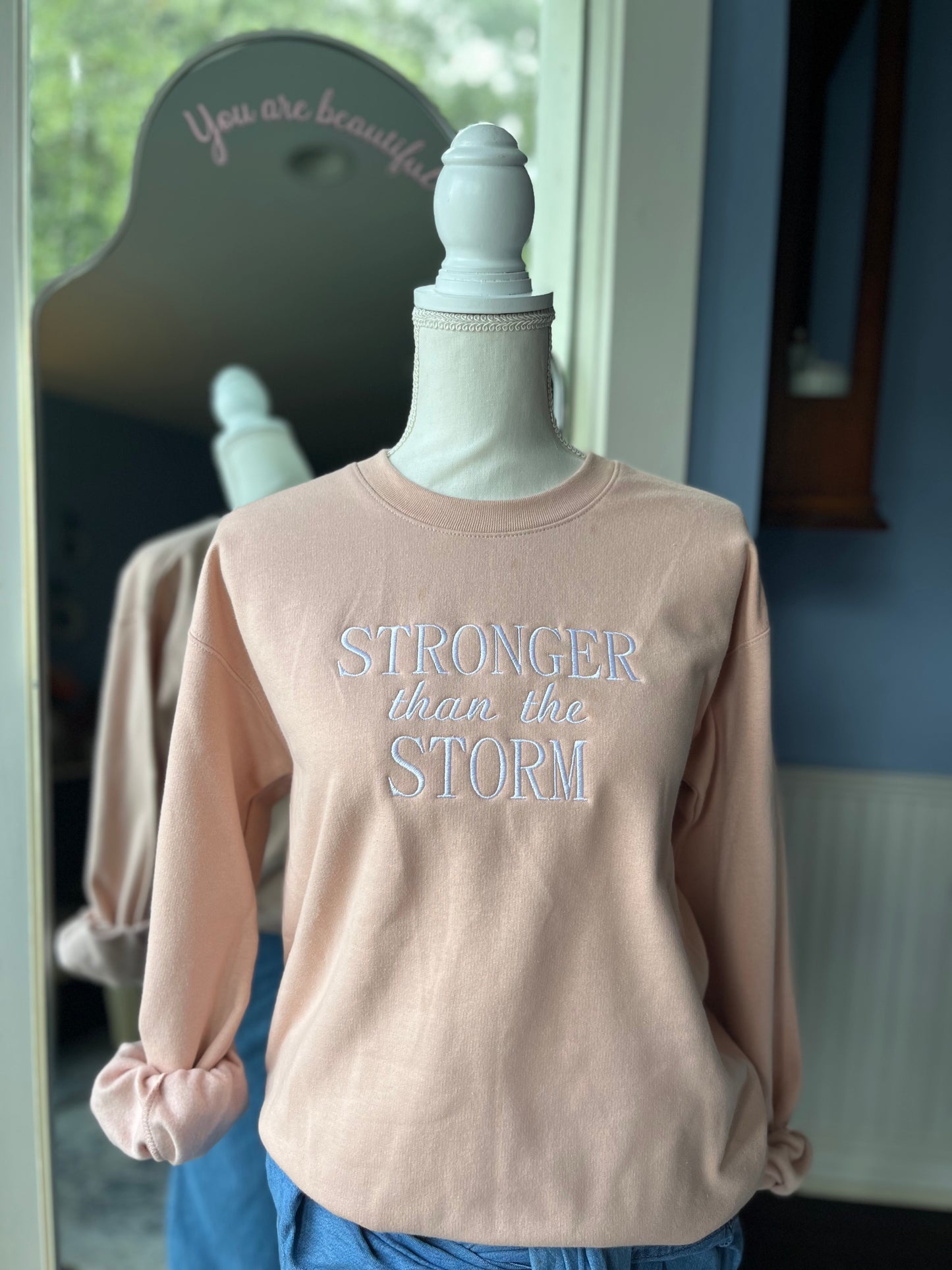 "Stronger Than The Storm" Blush Pink colored Crew Neck Sweatshirt