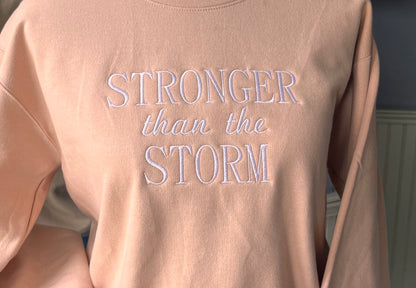 "Stronger Than The Storm" Blush Pink colored Crew Neck Sweatshirt