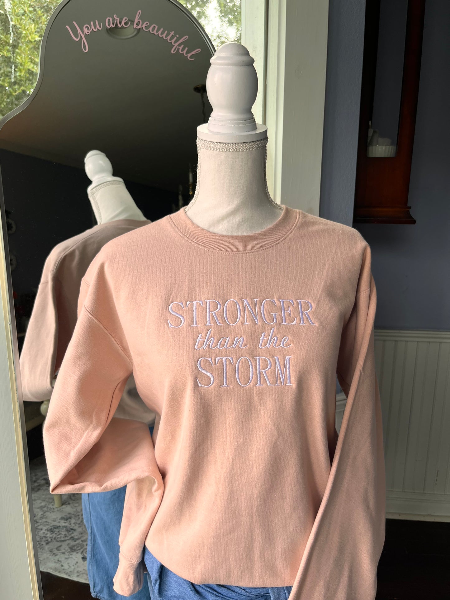 "Stronger Than The Storm" Blush Pink colored Crew Neck Sweatshirt