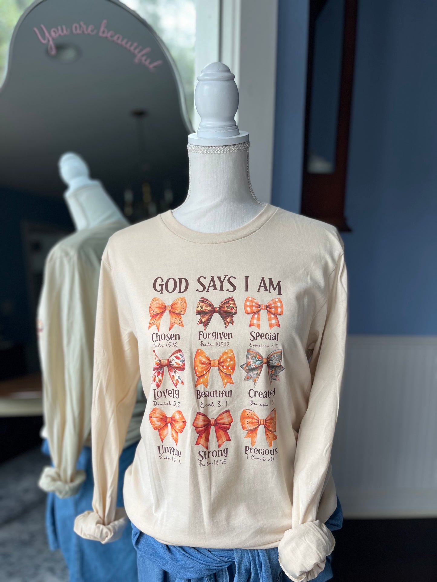 "God says I am..." Tan T-shirt with affirming bible verses.