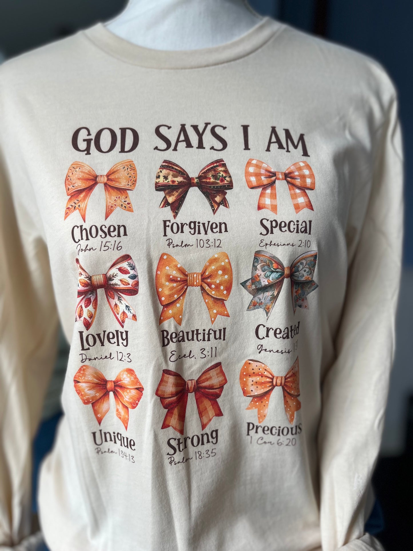 "God says I am..." Tan T-shirt with affirming bible verses.